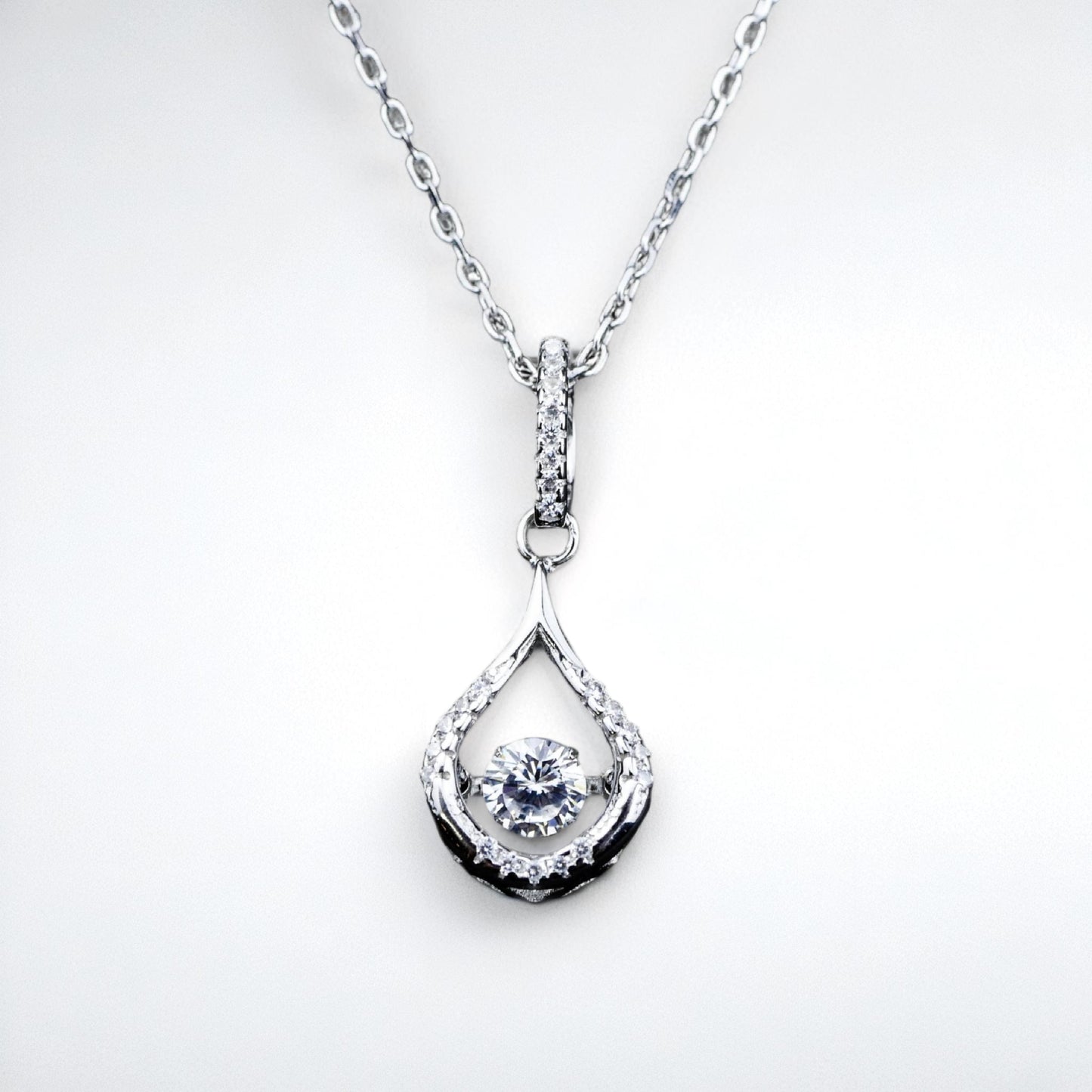 Silver teardrop pendant necklace on a white background