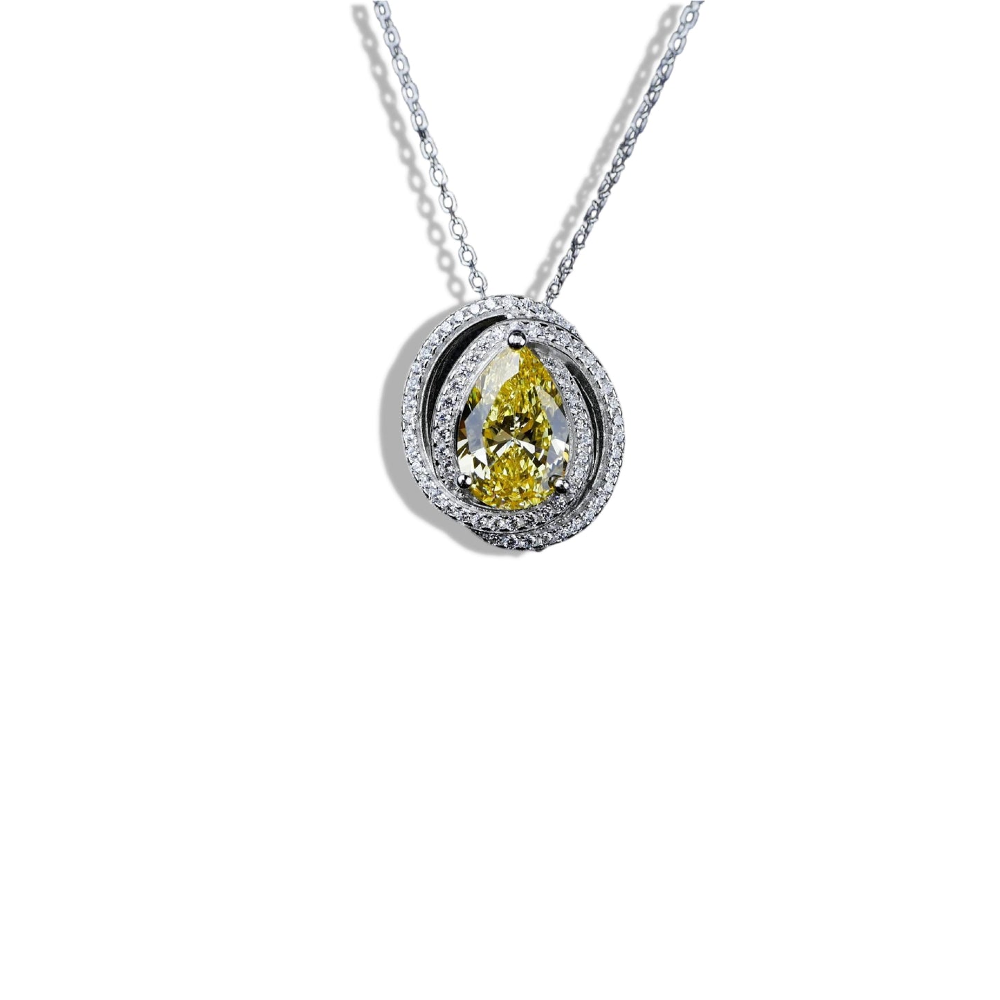 Diamond necklace with a yellow pear-shaped gemstone on a white background