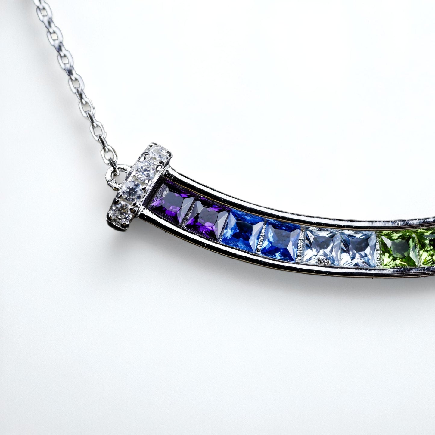 Necklace with multicolored gemstones on a white background