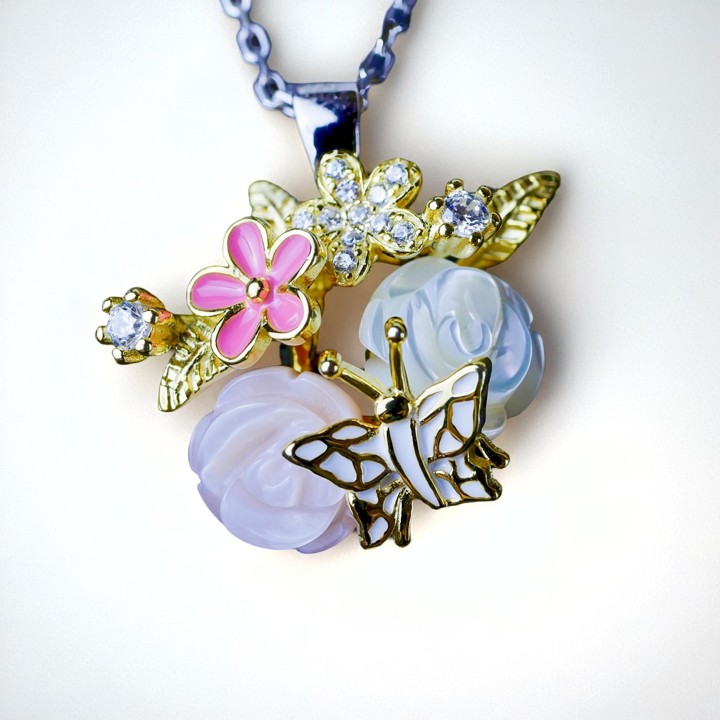Necklace with floral and butterfly pendants on a white background