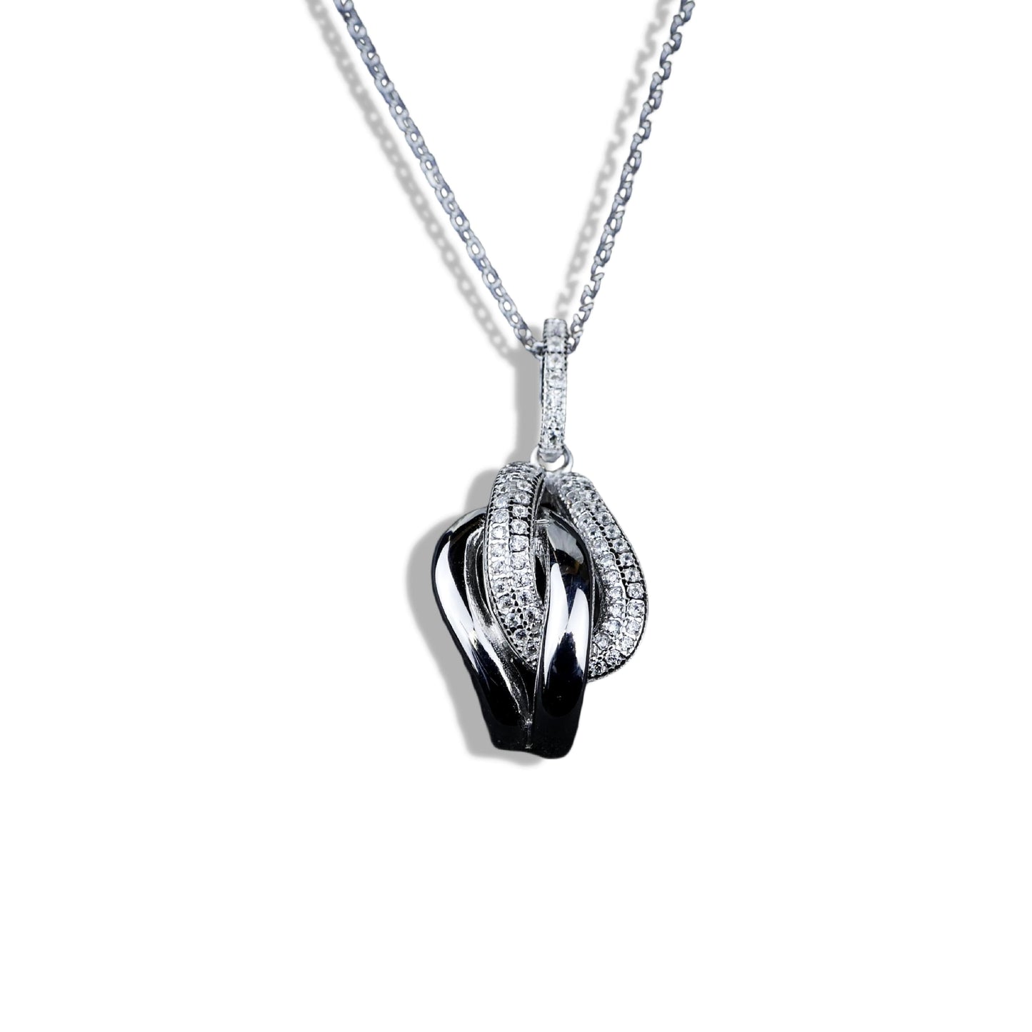Silver necklace with a black and silver pendant on a white background