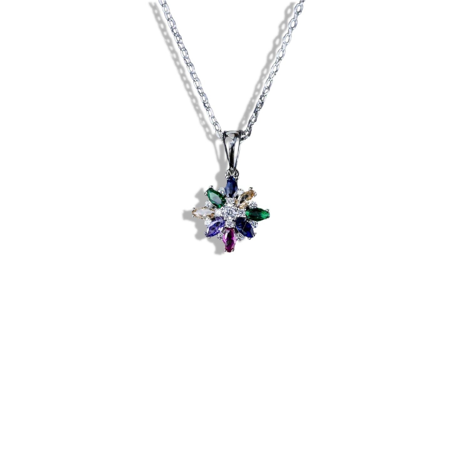Multicolored gemstone pendant on a chain against a white background