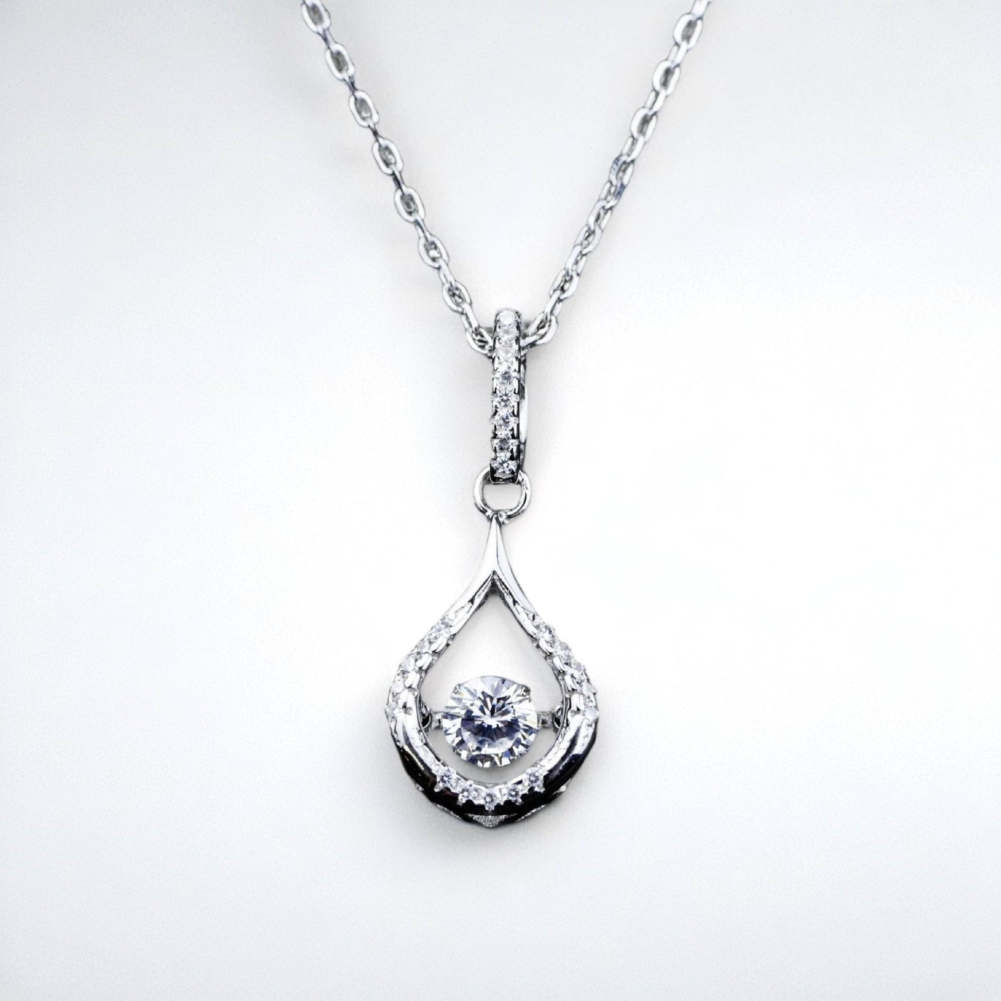 Silver teardrop pendant necklace on a white background