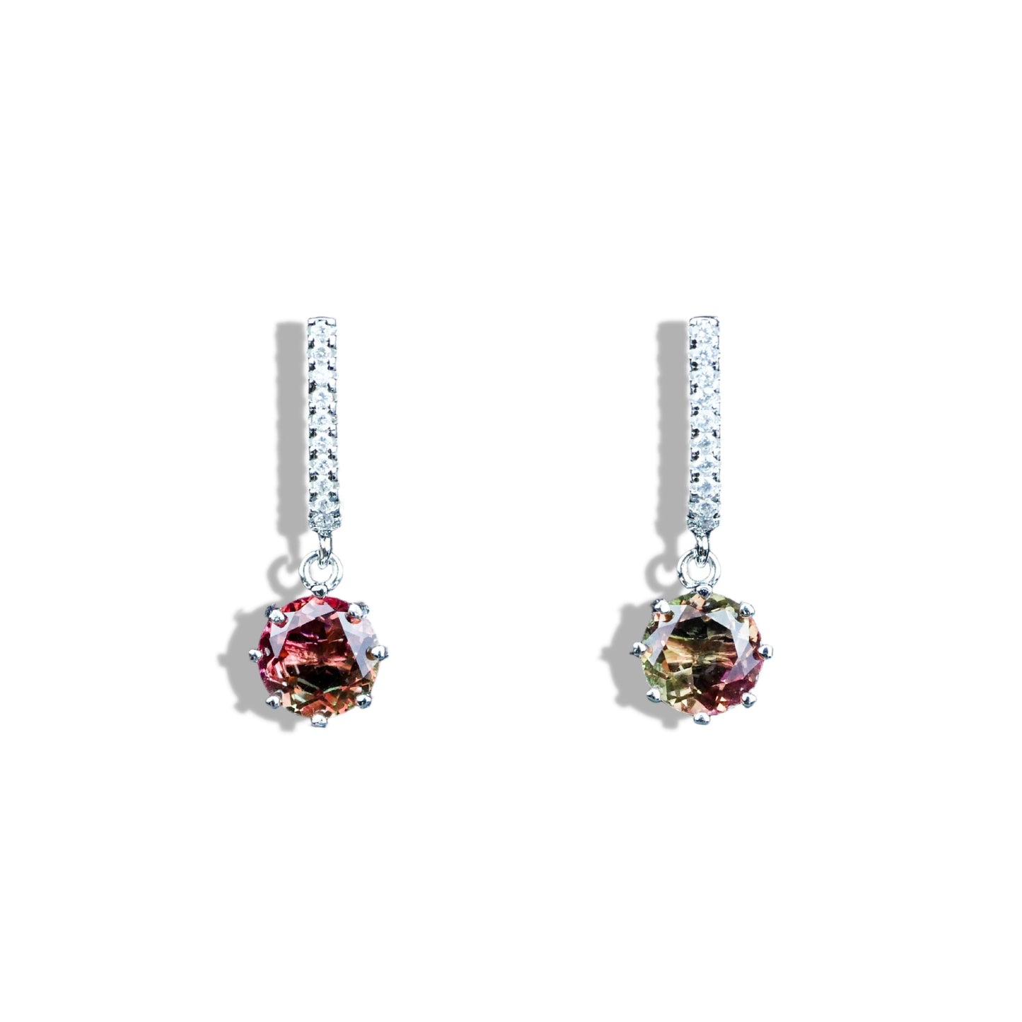 Pair of earrings with multicolored gemstones on a white background