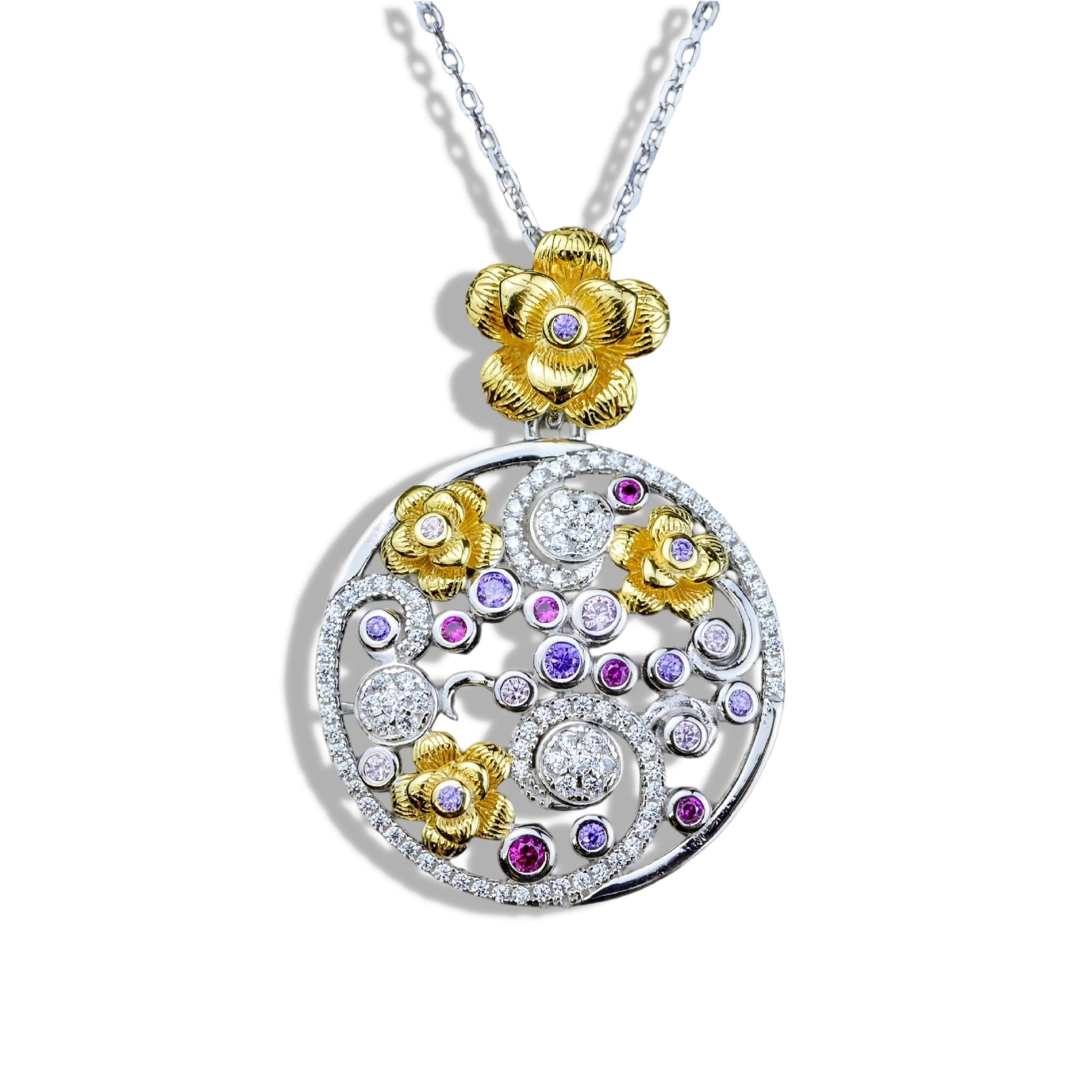 Jewelry necklace with a round pendant featuring gold flowers and colorful gemstones on a white background.
