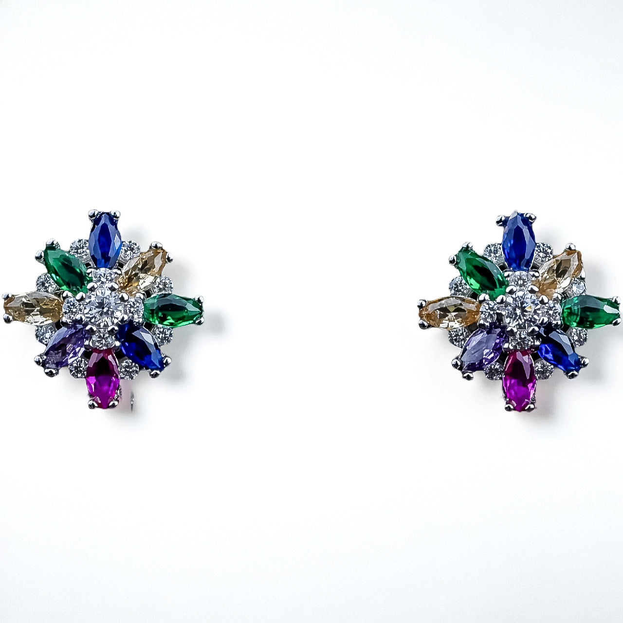 Multicolored gemstone earrings on a white background