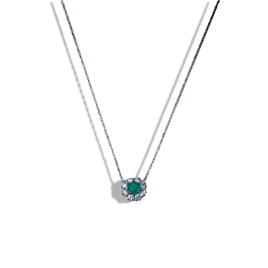 Necklace with a green gemstone pendant on a white background