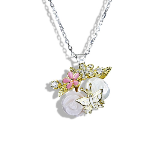 Necklace with floral and butterfly pendant on a white background