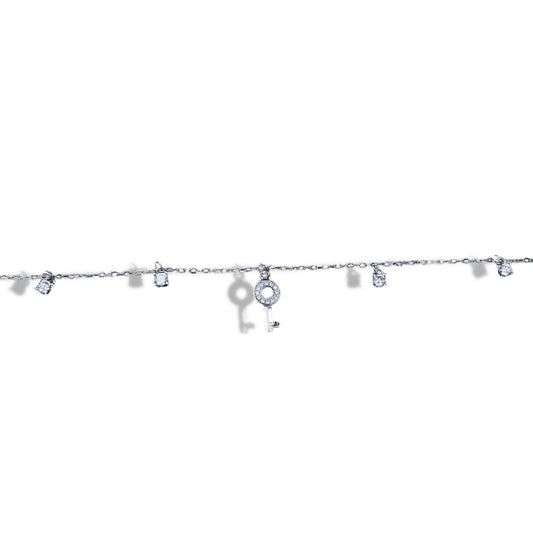 Silver bracelet with key-shaped charms on a white background